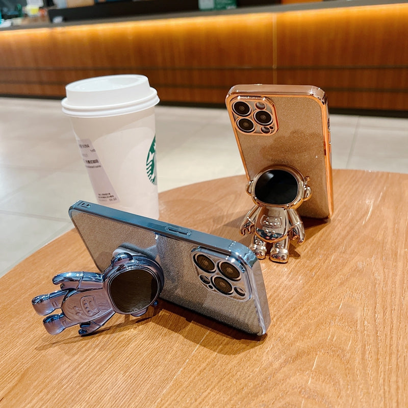 Luxus-Glitzer-Astronauten-Falt-Silikonhülle mit Ständer und Handhalterung für Apple iPhone 17/17 Air, 16/16e, 15, 14, 13 Pro Max Plus | Stoßfest, wasserabweisend & fingerabdruckfrei