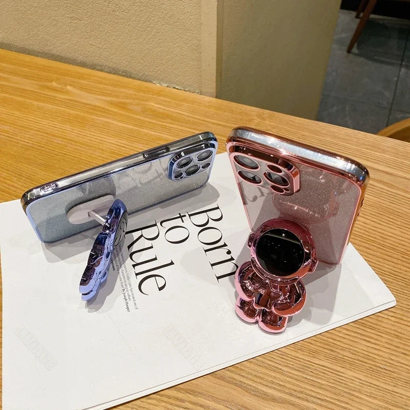 Luxus-Glitzer-Astronauten-Falt-Silikonhülle mit Ständer und Handhalterung für Apple iPhone 17/17 Air, 16/16e, 15, 14, 13 Pro Max Plus | Stoßfest, wasserabweisend & fingerabdruckfrei